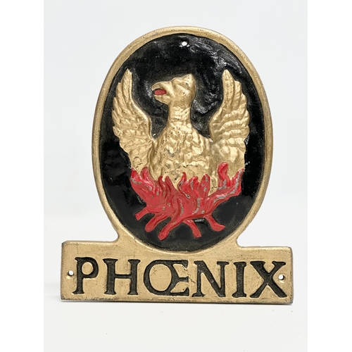 403 - Phoenix Insurance. A cast wall plaque and a framed advertising sign. 34x49cm