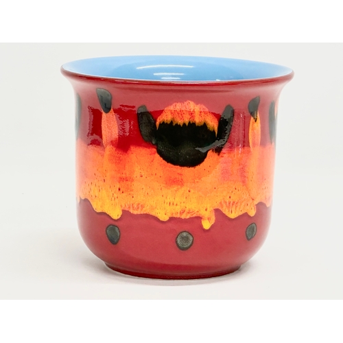 71 - A pair of Poole Pottery ‘Flambé Volcano’ jardiniere/planters. 17.5x15cm