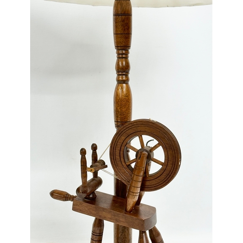 420 - A large spinning wheel table lamp. 79cm