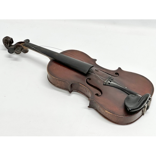 2 - An Early 20th Century violin with bows. Named and dated 1924.