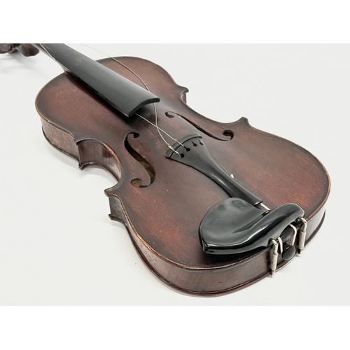 2 - An Early 20th Century violin with bows. Named and dated 1924.