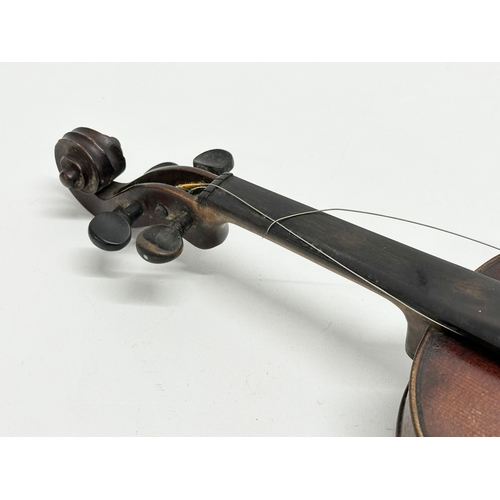 2 - An Early 20th Century violin with bows. Named and dated 1924.