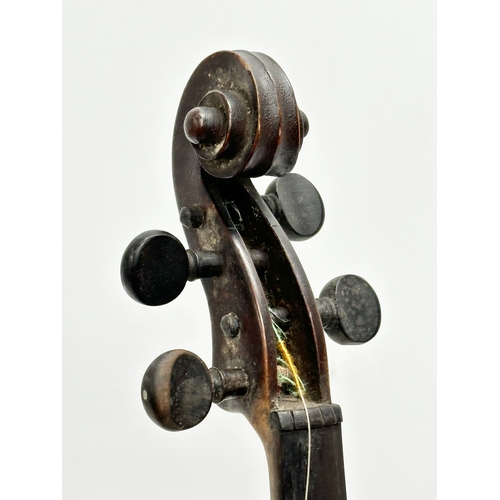 2 - An Early 20th Century violin with bows. Named and dated 1924.