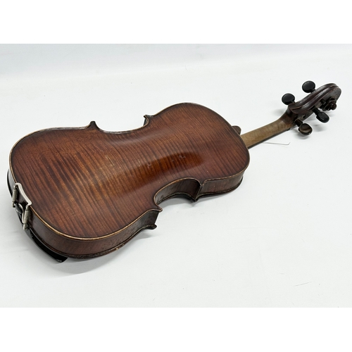 2 - An Early 20th Century violin with bows. Named and dated 1924.