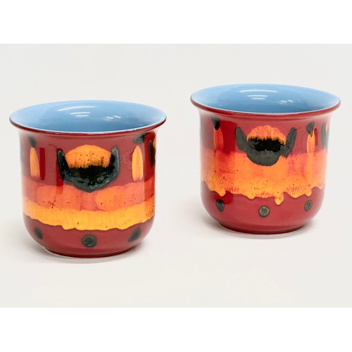 71 - A pair of Poole Pottery ‘Flambé Volcano’ jardiniere/planters. 17.5x15cm