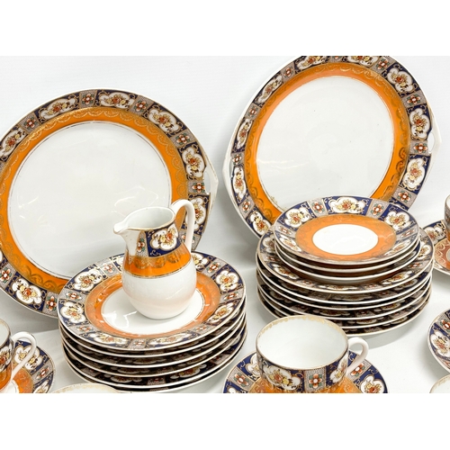 106 - An Early 20th Century 34 piece Beyer & Boch Imari pattern tea service. Circa 1905-1931. 2 cake plate... 