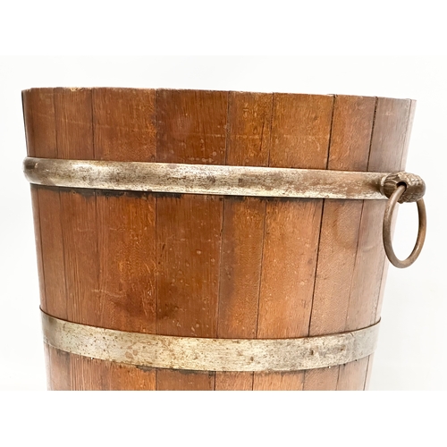 117 - A large Late 19th Century oak coal bucket with large drop ring handles. Circa 1880-1900. 53x45x43.5c... 