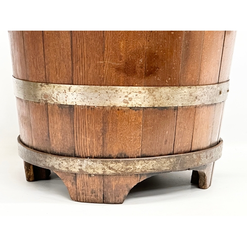 117 - A large Late 19th Century oak coal bucket with large drop ring handles. Circa 1880-1900. 53x45x43.5c... 