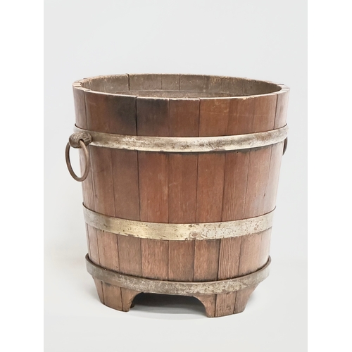 117 - A large Late 19th Century oak coal bucket with large drop ring handles. Circa 1880-1900. 53x45x43.5c... 