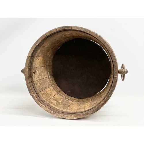 117 - A large Late 19th Century oak coal bucket with large drop ring handles. Circa 1880-1900. 53x45x43.5c... 