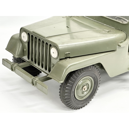 407 - A vintage Marx army jeep and trailer. 88cm