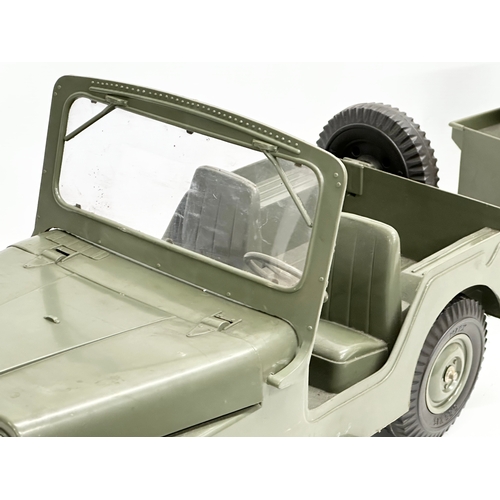 407 - A vintage Marx army jeep and trailer. 88cm