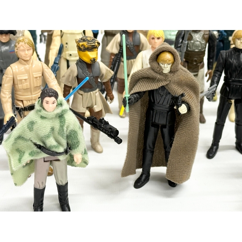 408 - A collection of 1970’s/80’s Star Wars action figures and weapons.