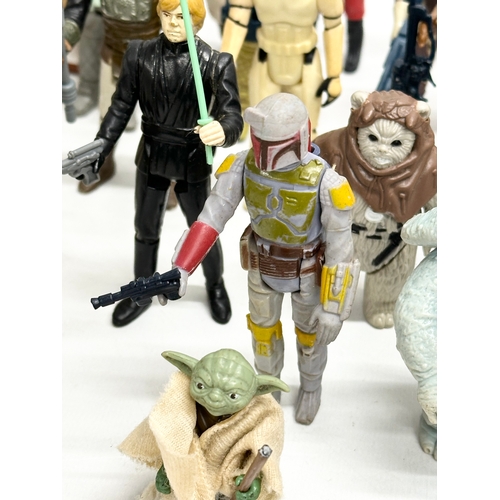 408 - A collection of 1970’s/80’s Star Wars action figures and weapons.