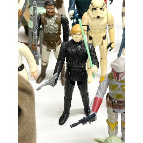 408 - A collection of 1970’s/80’s Star Wars action figures and weapons.