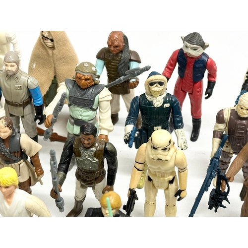 408 - A collection of 1970’s/80’s Star Wars action figures and weapons.