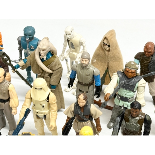 408 - A collection of 1970’s/80’s Star Wars action figures and weapons.