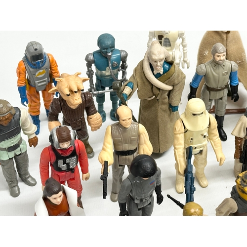 408 - A collection of 1970’s/80’s Star Wars action figures and weapons.