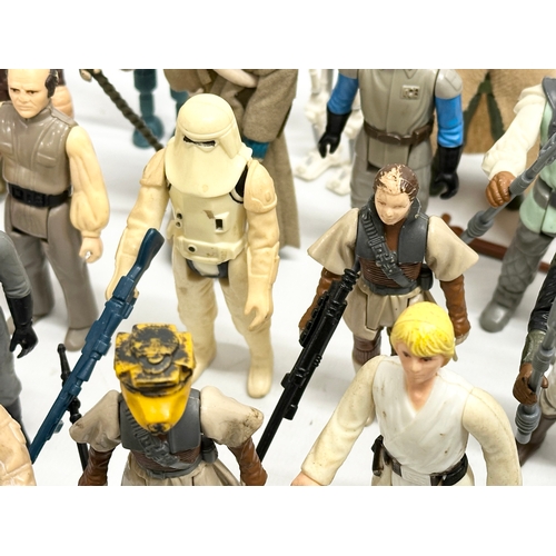 408 - A collection of 1970’s/80’s Star Wars action figures and weapons.