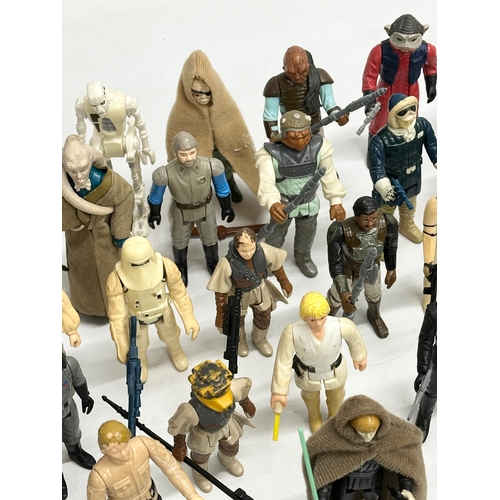 408 - A collection of 1970’s/80’s Star Wars action figures and weapons.