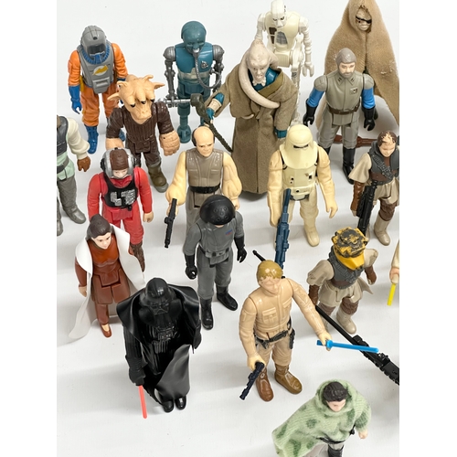 408 - A collection of 1970’s/80’s Star Wars action figures and weapons.