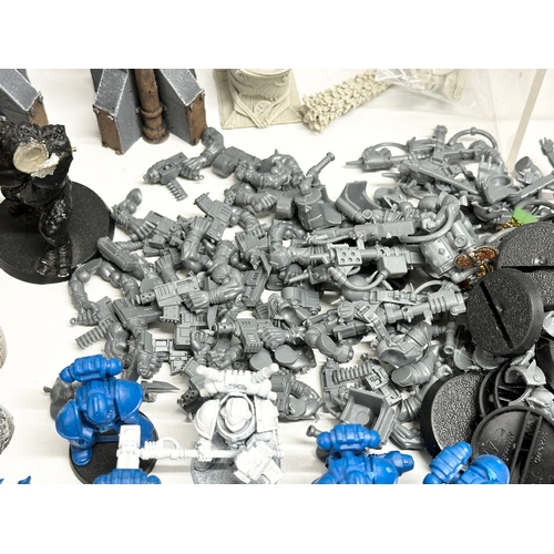 409 - A large collection of War Hammer figures and settings. War Hammer 400 etc.