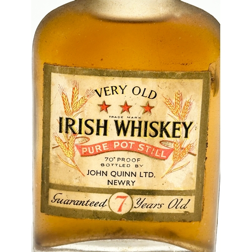 86 - A bottle of vintage Very Old Irish Whiskey. Bottled by John Quinn LTD, Newry. 70 proof.