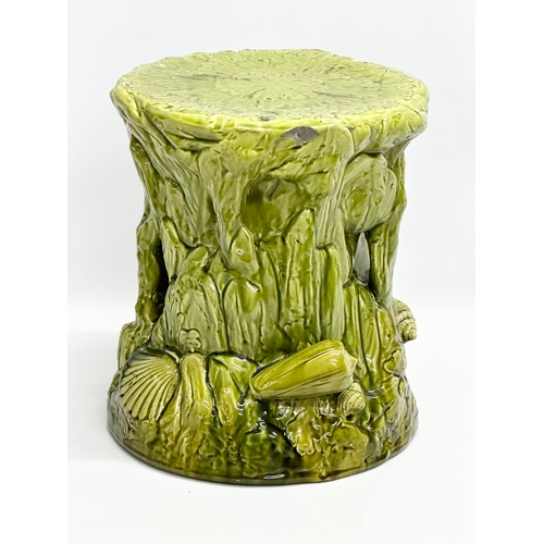 123 - 2 Late 19th Century Majolica garden seats/jardiniere stands. 1 (Bretby) damaged. 35x29cm. 31x34cm