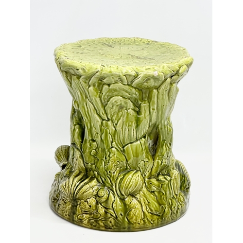 123 - 2 Late 19th Century Majolica garden seats/jardiniere stands. 1 (Bretby) damaged. 35x29cm. 31x34cm