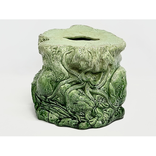 123 - 2 Late 19th Century Majolica garden seats/jardiniere stands. 1 (Bretby) damaged. 35x29cm. 31x34cm