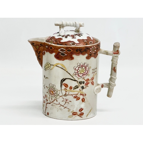 8 - A 19th Century Japanese hand painted chocolate pot/teapot. With bamboo design handle and embossed fl... 