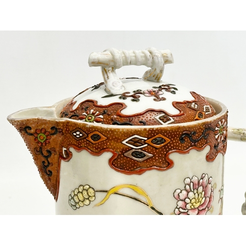 8 - A 19th Century Japanese hand painted chocolate pot/teapot. With bamboo design handle and embossed fl... 