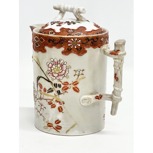 8 - A 19th Century Japanese hand painted chocolate pot/teapot. With bamboo design handle and embossed fl... 