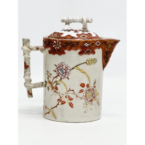 8 - A 19th Century Japanese hand painted chocolate pot/teapot. With bamboo design handle and embossed fl... 