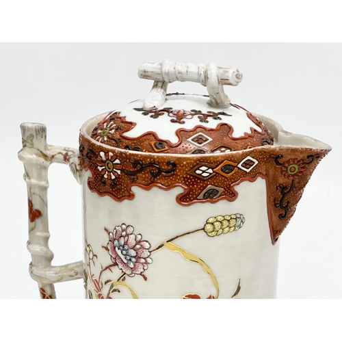 8 - A 19th Century Japanese hand painted chocolate pot/teapot. With bamboo design handle and embossed fl... 