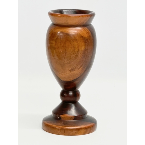 9 - A 19th Century turned wooden Lignum Vitae vase. 18.5cm