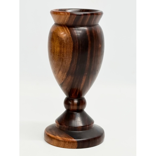 9 - A 19th Century turned wooden Lignum Vitae vase. 18.5cm