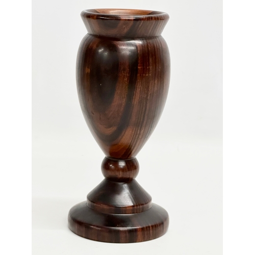 9 - A 19th Century turned wooden Lignum Vitae vase. 18.5cm