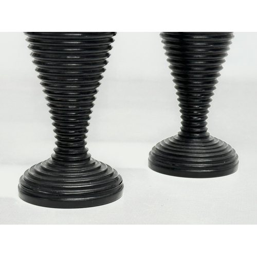 10 - A pair of Late 19th Century turned ebony candleholders/vases. 16cm.