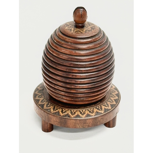 13 - A Mid 19th Century Lignum Vitae turned fruitwood beehive string box. 9x12cm