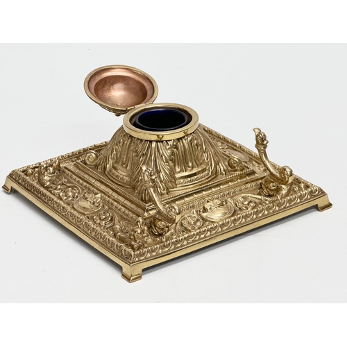 36 - A Late 19th Century Victorian brass inkstand/inkwell with original Bristol Blue liner. 18.5x18.5x10c... 