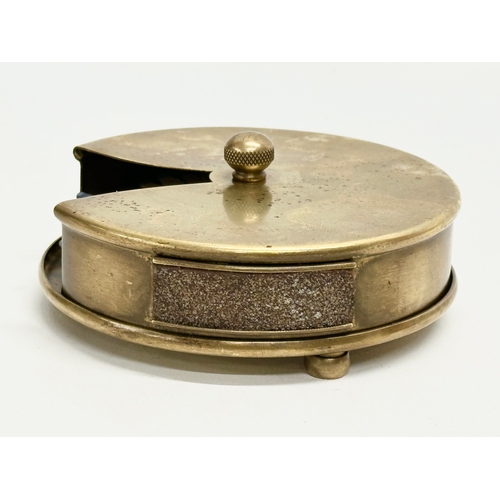 118 - A Late 19th/Early 20th Century brass revolving match striker. 12x5cm