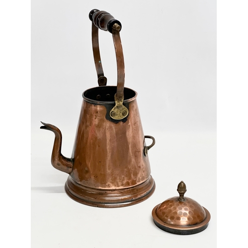 181 - A large Victorian copper coffee pot. 23x18x35cm including handle.