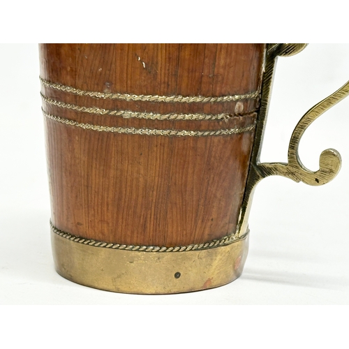 182 - A Late 19th Century Victorian brass bound Yew wood tankard. 12x8.5x13cm