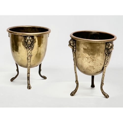 15 - A pair of Mid/Late 19th Century brass jardinières/planters raised on 3 lion paw feet and copper stud... 