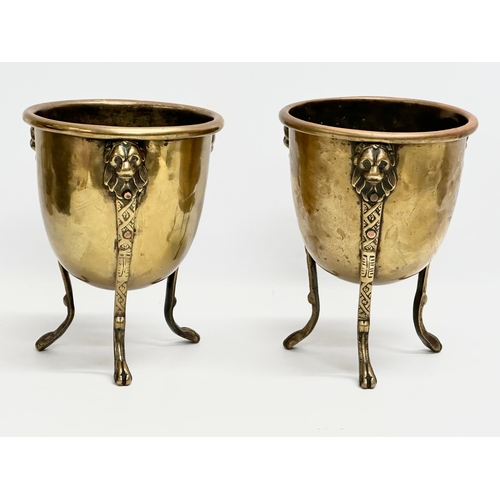 15 - A pair of Mid/Late 19th Century brass jardinières/planters raised on 3 lion paw feet and copper stud... 