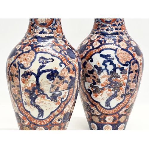 91 - A pair of large Late 19th Century Japanese Meiji period Imari baluster vases. Circa 1880. 15x31cm