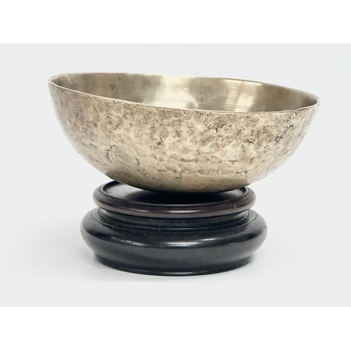 92 - A Late 19th Century Tibetan Singing bowl on stand. Bowl measures 16x6cm