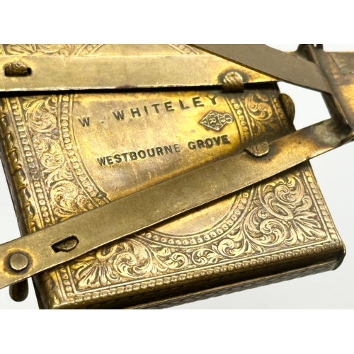 96 - A Late 19th Century Victorian W. Whiteley brass easel needle case. 11cm