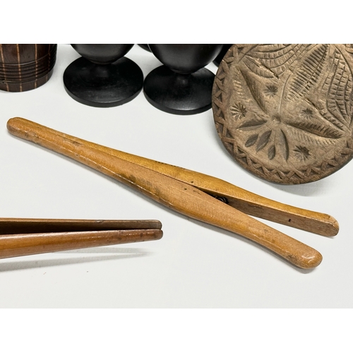 202 - A collection of 19th Century Treen Ware. Salt shaker, egg cups, butter pat, pestle etc